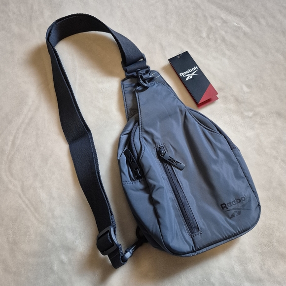 Reebok Handbags - NWT Reebok Crossbody sling bag backpack purse blue
